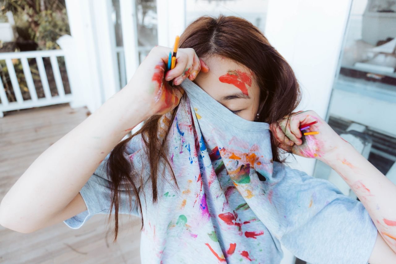 person with paint on clothes