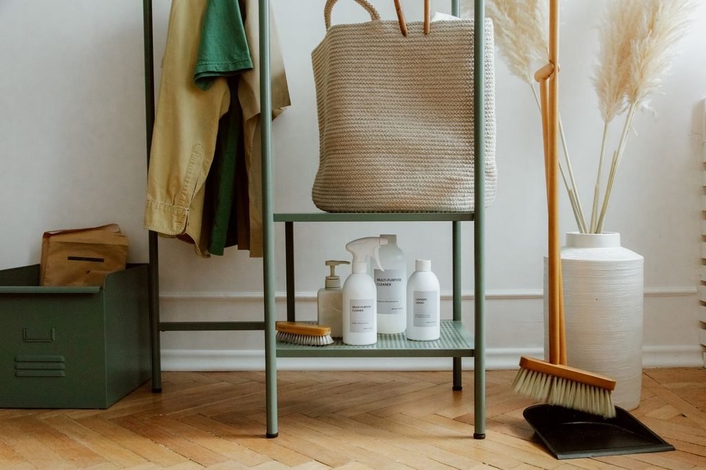 How to clean a mop and broom: Bottles of cleaning products on a shelf for cleaning a mop and broom